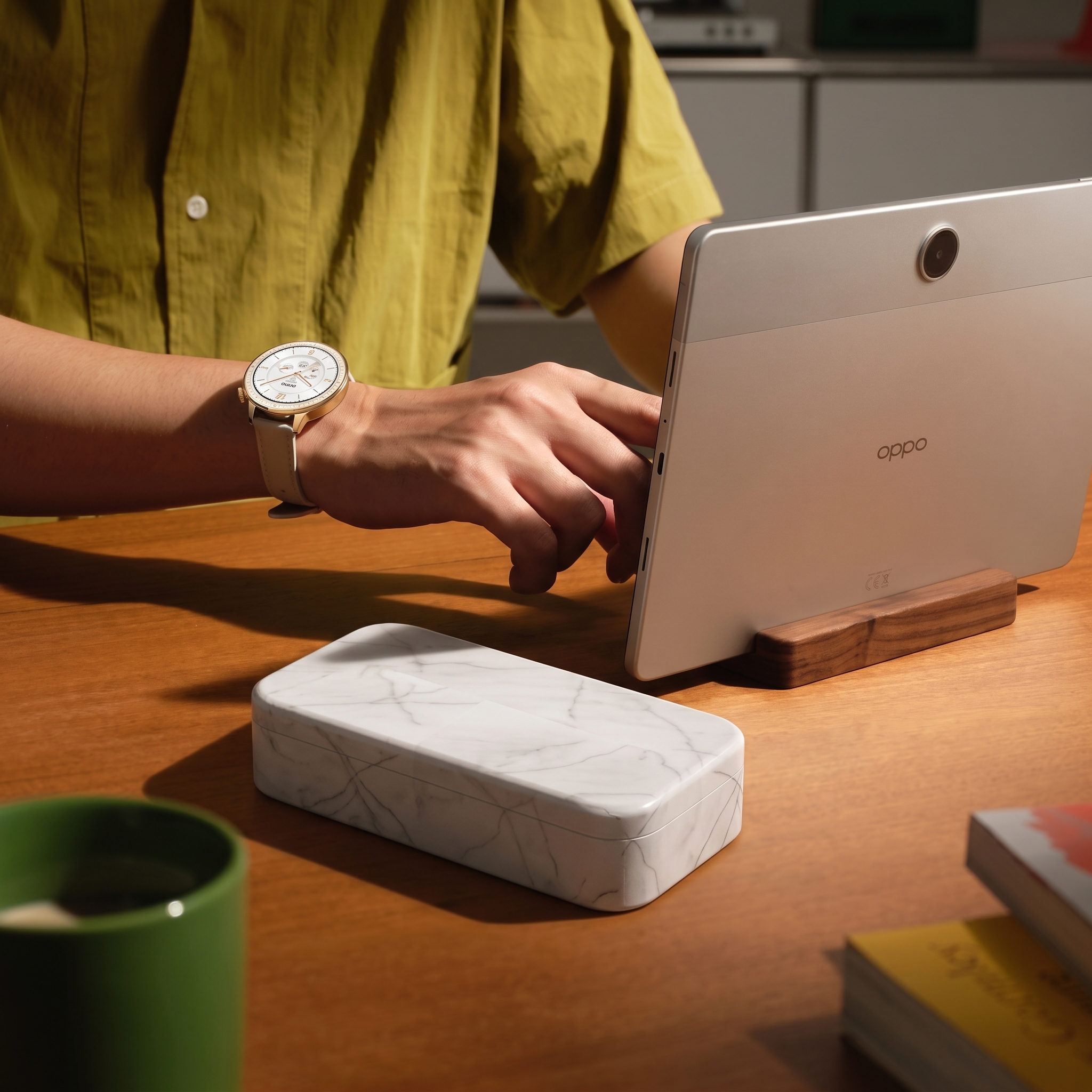 Phone Casket sealed on a warm oak desk beside a tablet